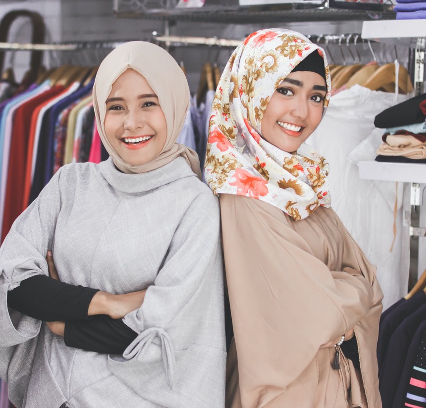two asian female boutique fashion store owner
