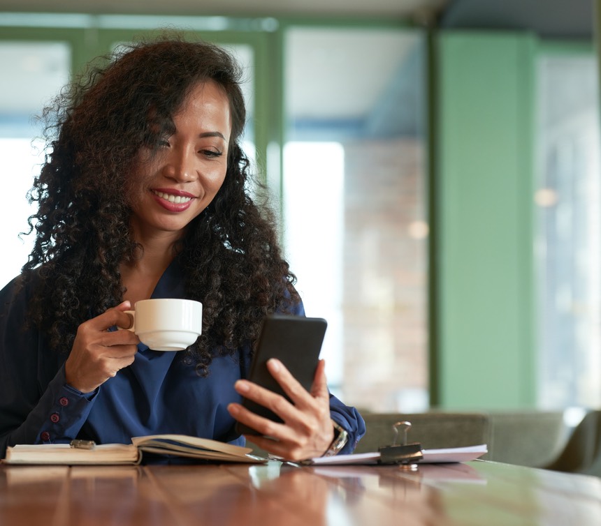 Pretty Businesswoman Taking Coffee Break